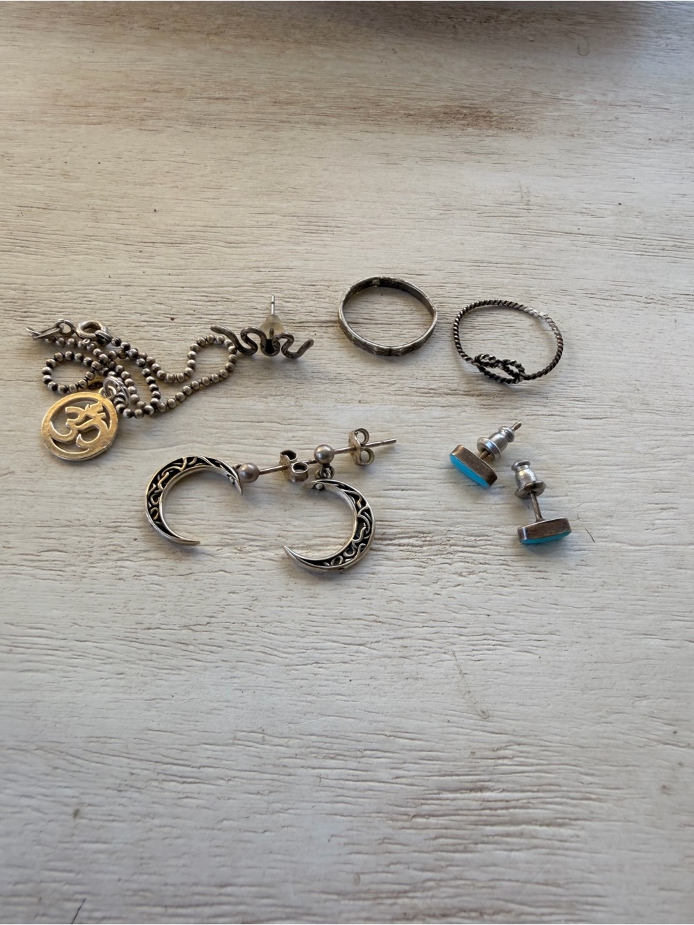 Sterling silver earrings, charms and rings lot.